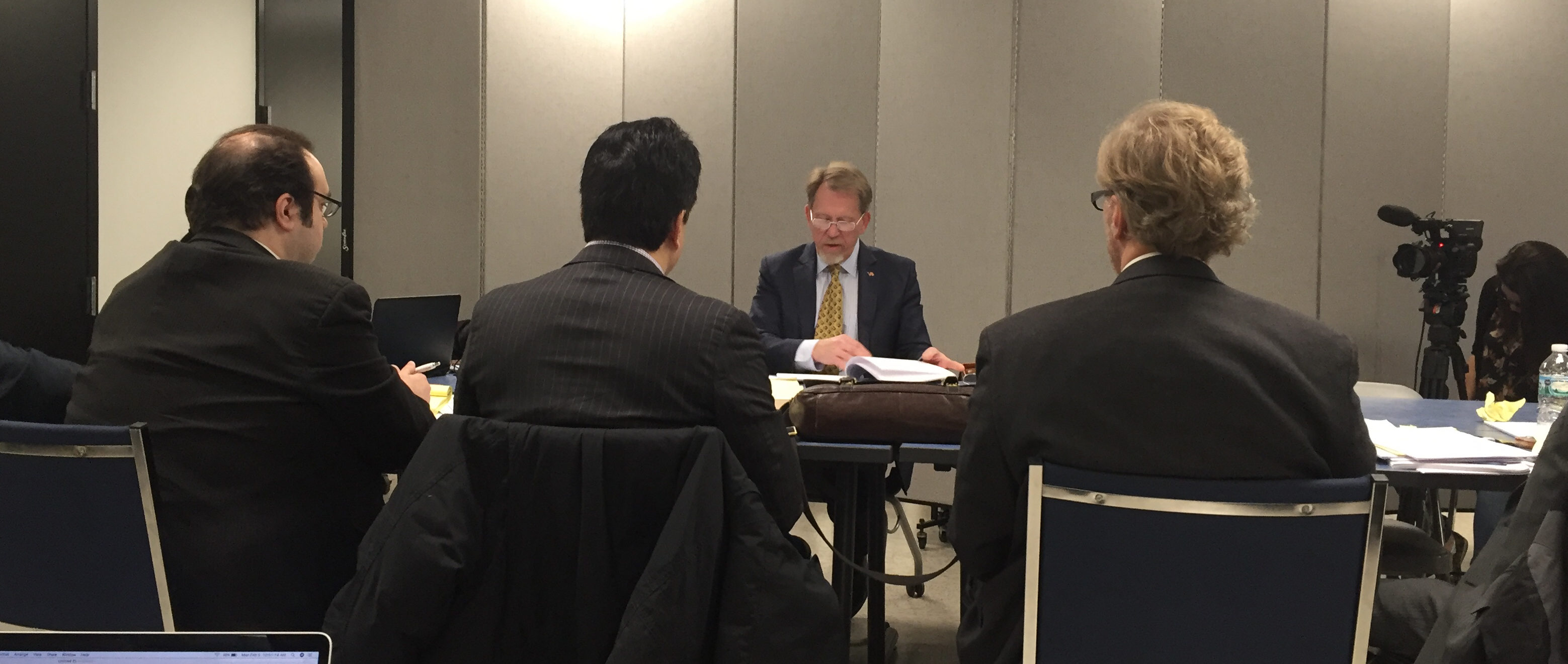 Hearing officer Chris Agrella delivers his final recommendations to attorneys Frank Avila (left) and Andrew Finko (right) on Feb. 5, 2018